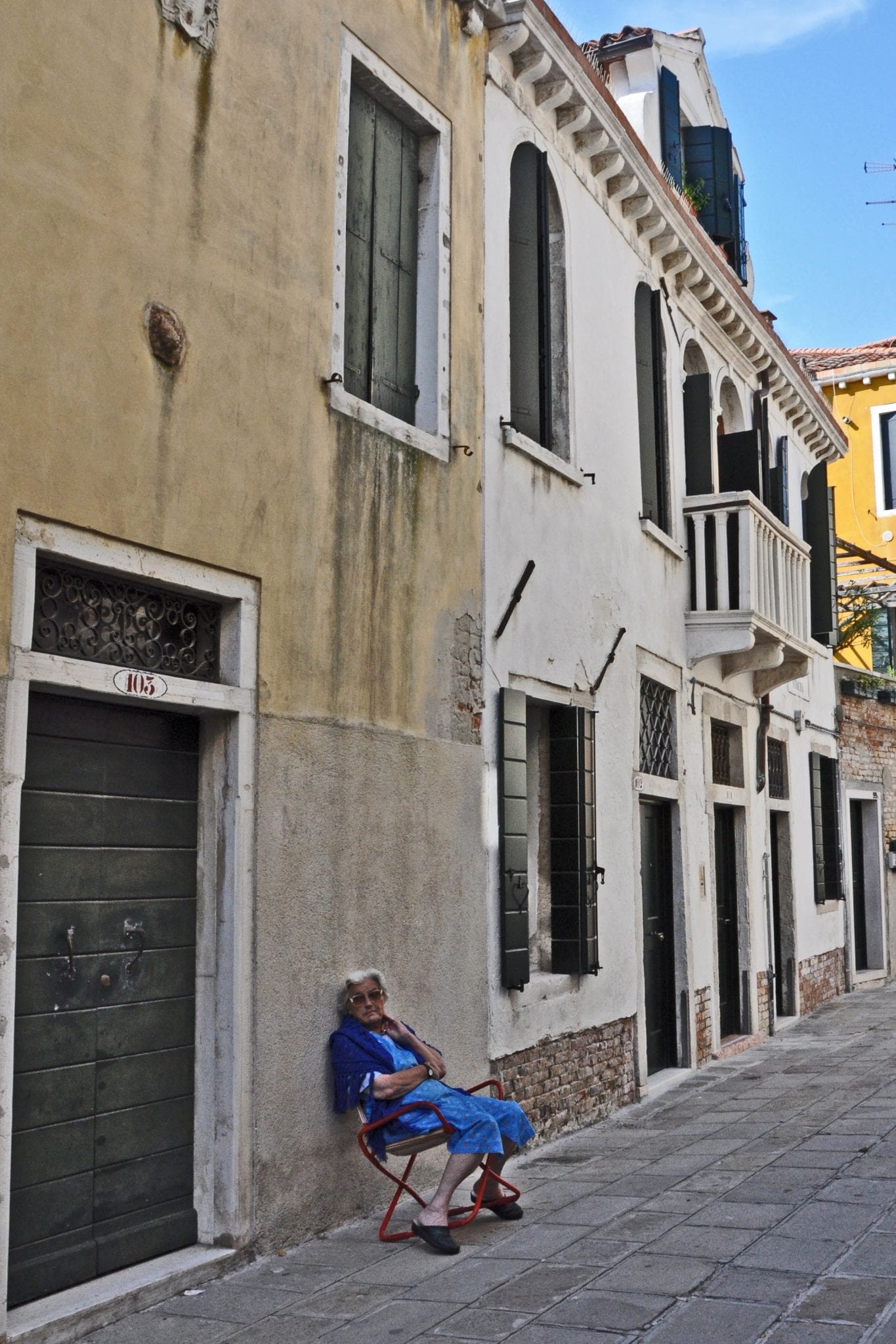 A woman relaxes in the The Castello neighborhood of Venice