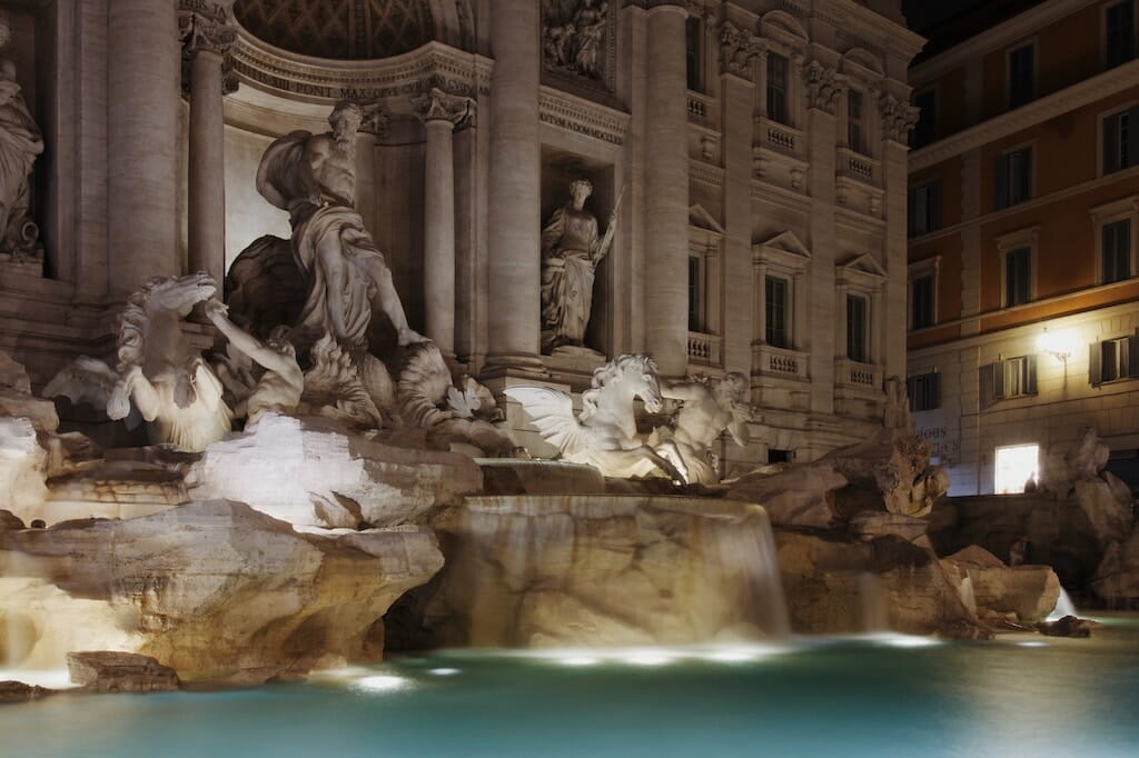 Trevi Fountain after dark with lights on the water