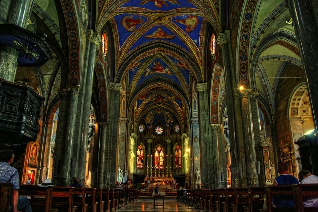 Rome's Santa Maria Sopra Minerva church ceiling in the dark with stars and gilded tiles