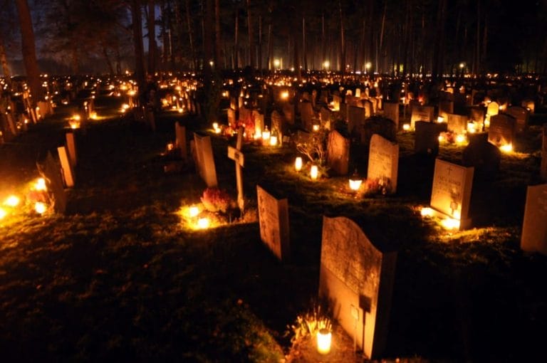 Candles placed on graves on All Soul’s Day
