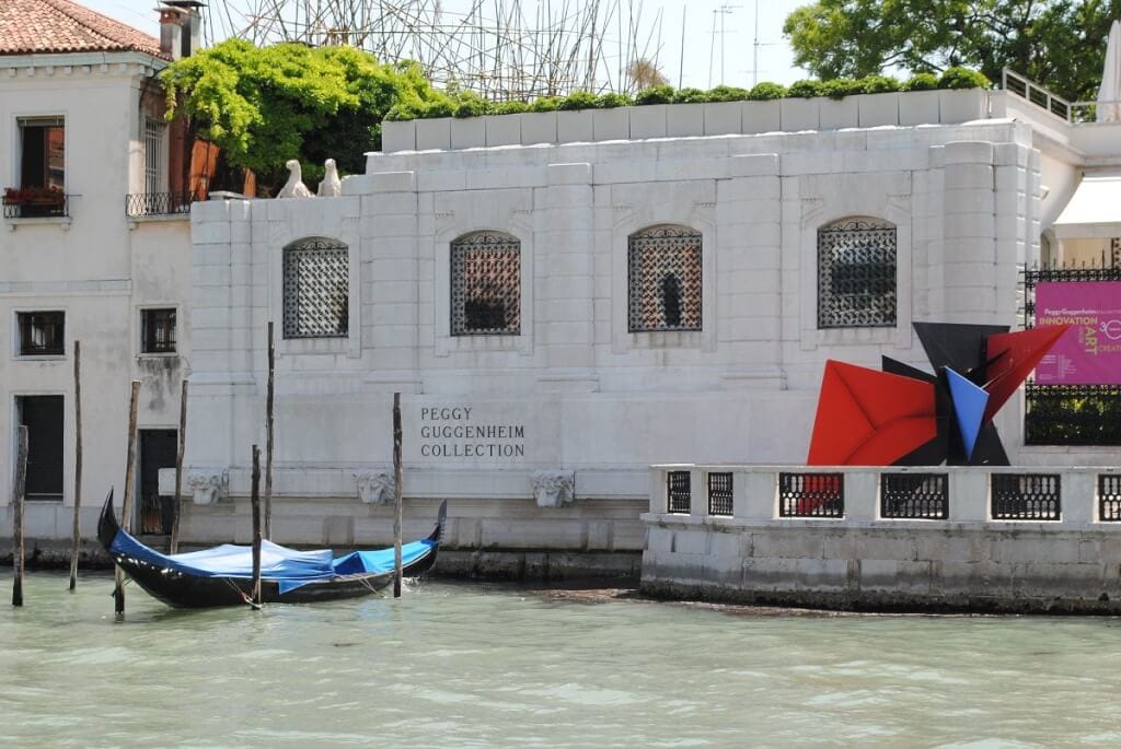Peggy Guggenheim Collection in venice with gondola and modern art out front