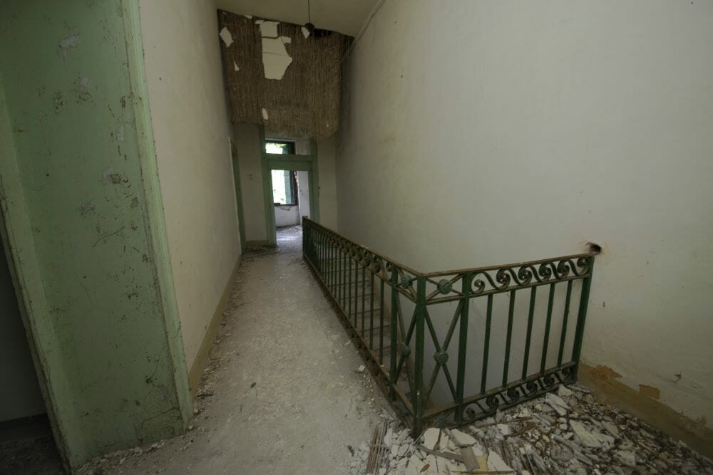 A view inside Poveglia Psychatric Hospital, in Venice, displaying an abandoned building and its hallways