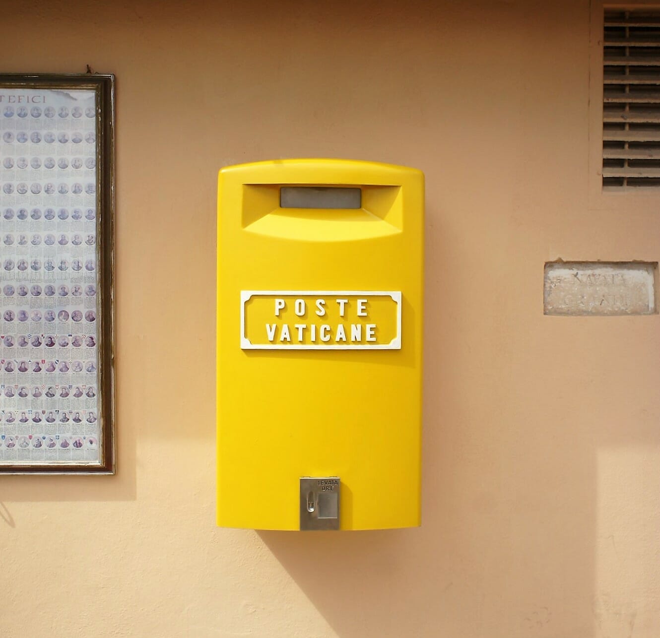 A yellow mailbox in Vatican City which reads 'Poste Vaticane'