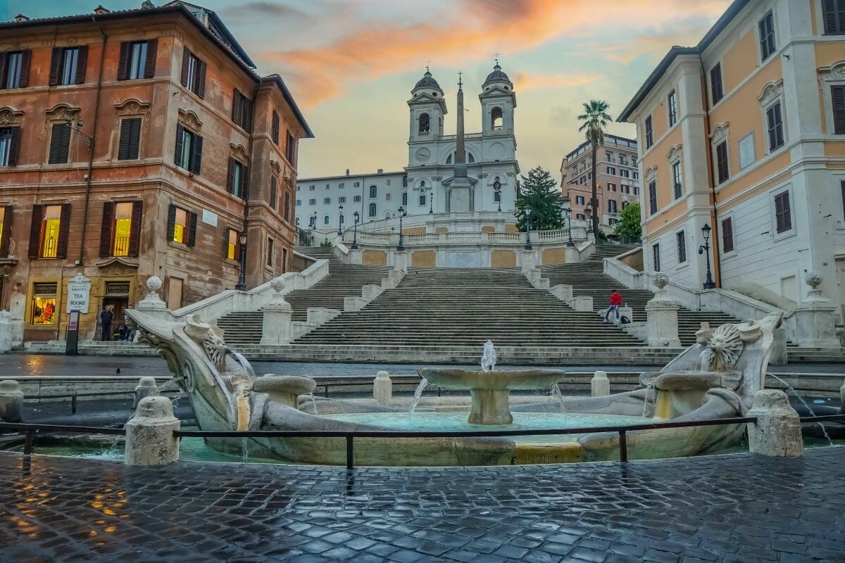 A view of the Spanish Steps in Rome at sunset.