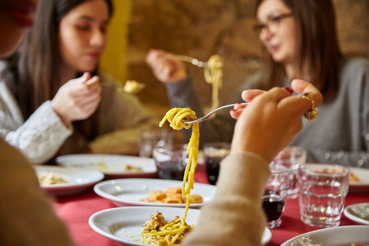 people eating thebest carbonara in Rome